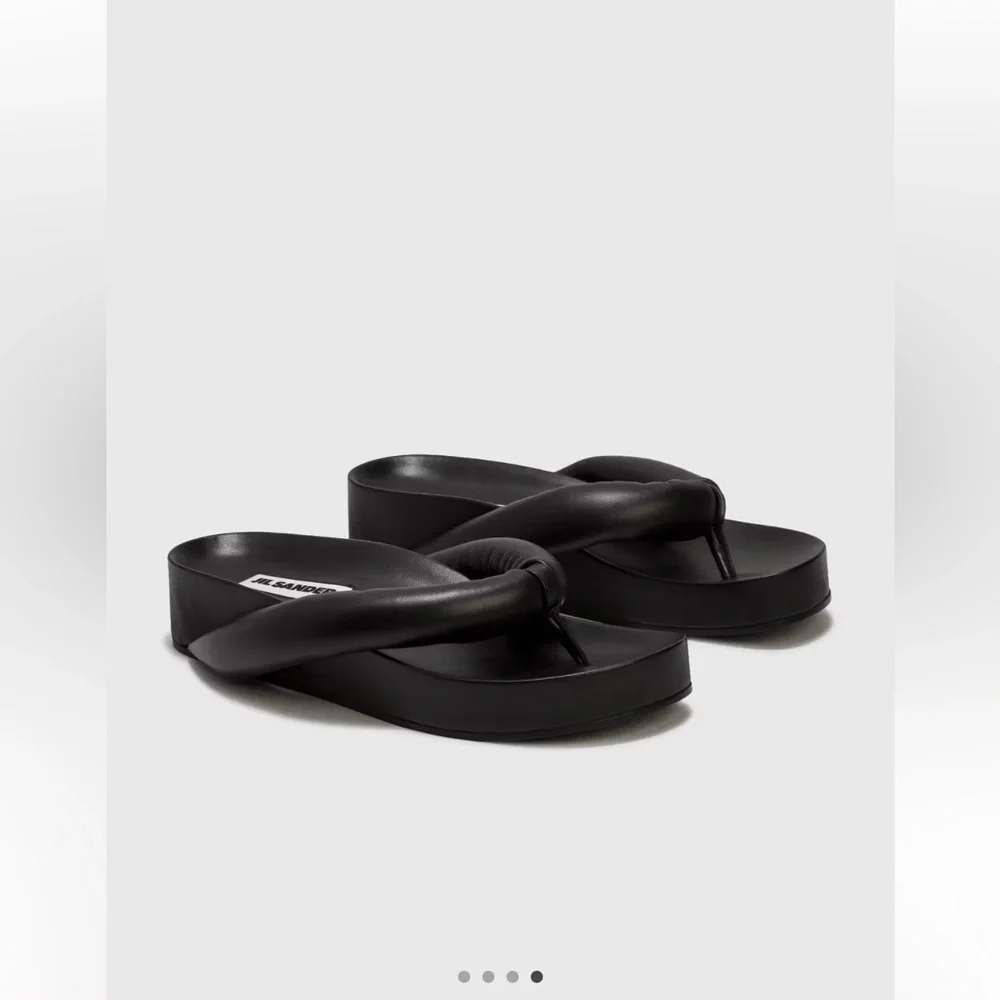 Jil Sander conditioned flop signs
